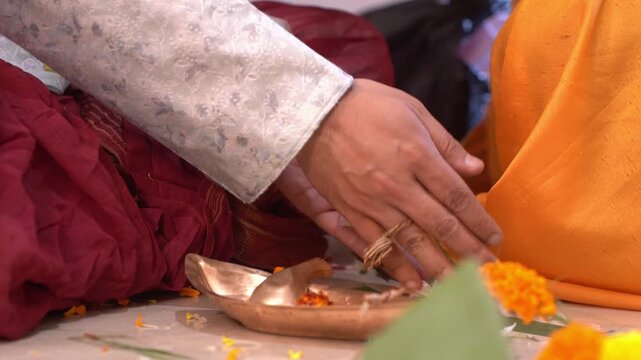 Hindu man performing yagna in traditional Indian way