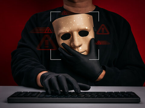 Man holding artificial face mask with facial recognition scanning overlay, representing AI deepfake technology, online scam, identity fraud, fake media detection, and cybersecurity threat awareness.