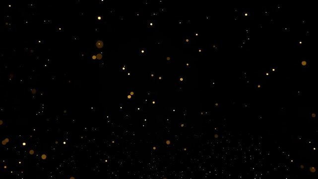 Golden particles sparkle against a dark background, creating a mesmerizing visual. The particles seem to be floating