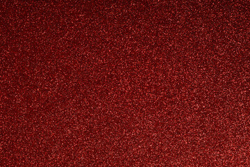 Fototapeta premium Abstract red glitter background texture. Perfect for Christmas, Valentine's Day, New Year, holiday, celebration, and lux