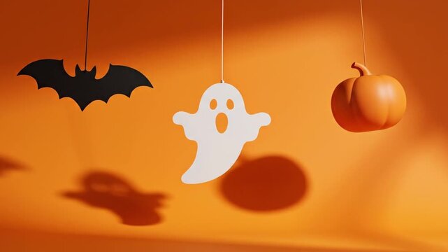halloween hanging decor elements swinging smoothly in gentle motion three objects entering frame from the side thin string suspension solid orange background minimal design seamless loop soft shadows 