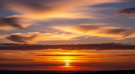 Obraz premium Vibrant Sunset Horizon with Colorful Clouds and Warm Orange Sky.