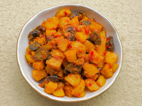 Sambal goreng kentang hati ampela, a traditional Indonesian dish made with diced potatoes, chicken liver, and gizzard cooked in rich spices, spicy chilies, and aromatic seasonings