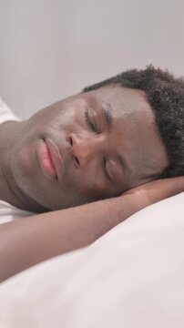 African American Man Sleeping in Bed on Side, vertical video
