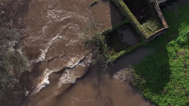River next to abandoned water mill building