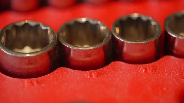 macro close-up of increasing metric socket set sockets in a red toolbox