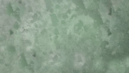 一面がグランジな粒子と不均一でランダムなムラのある模様の抽象的な背景・テクスチャー向け画像素材　JPEG　8K UHDサイズ　ライトグリーン・セージグリーン・くすんだ明るい緑