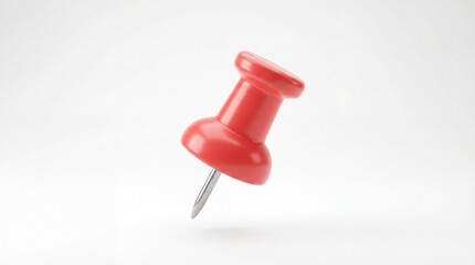 Red push pin on white background close-up studio shot.