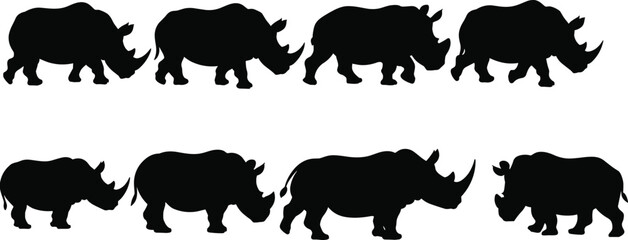 Black rhinoceros silhouettes set group of rhino walking icons isolated on white background for safari animal wildlife conservation and african nature design concept © SUSHANTO