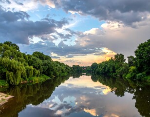 Reflective river landscape with overcast sky and verdant trees on banks