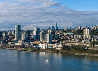 Vibrant Waterfront Cityscape With Tall Buildings Along Fraser River in New Westminster