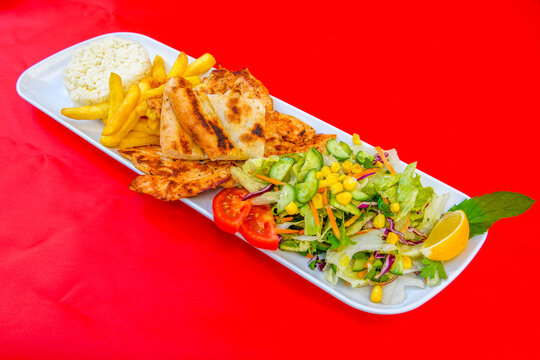 Famous Urfa meat liver, ciger wrapped by lavash with roasted chili pepper, onion and sauce in Sanliurfa, Turkey. Izgara kuzu et sis ciger. Izgara dana bonfile, cop sis, kuzu pirzola. Karisik kebap.
