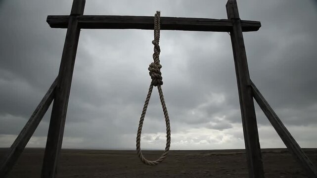 A somber wooden gallows with a hangman's noose under a dark, cloudy sky, evoking despair.