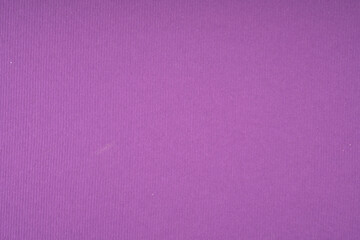 Purple ribbed paper texture background with deep violet color and vertical line pattern surface for creative art craft