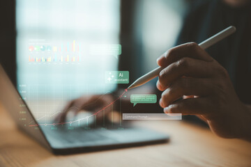Person using stylus pen with laptop and data analytics interface showing AI assistant and growth charts