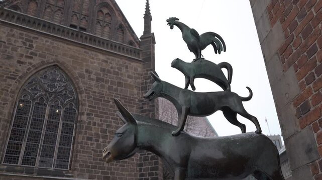 Iconic landmarks from the center of Bremen, the Town Musicians, the Dom Cathedral.
