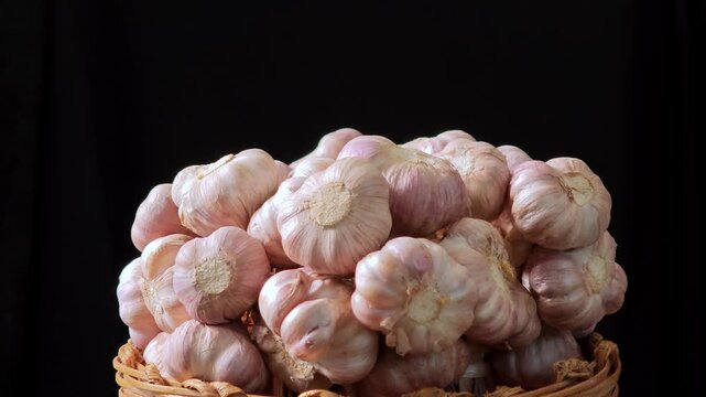 Fresh garlic on a black background.