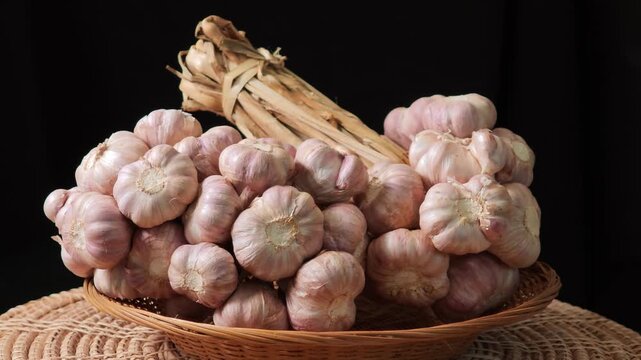 Fresh garlic on a black background.