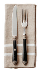 Silverware set on a folded linen napkin, top view