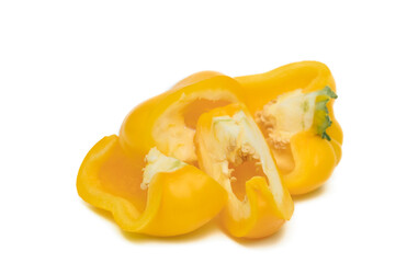 Sliced ​​pieces of yellow pepper on a white background