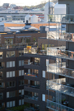 Modern city architecture with apartments residential facade pattern of balconies in urban Stockholm Sweden showing repeating design and contemporary housing