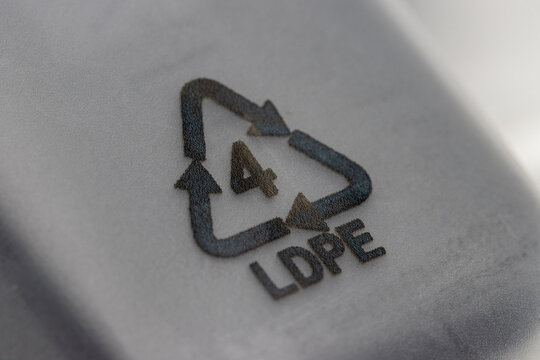 close up shot of plastic recycle symbol also known as resin identification symbol, LDPE 4. LDPE stand for low density polyethylene .