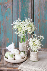 Florist at work: woman shows how to make Easter floral table decoration with arabian star flowers...