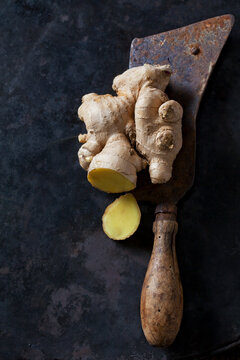 Sliced ginger root on an old knife