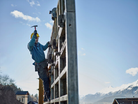 Construction worker working on plywood