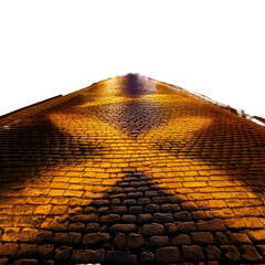 Cobblestone road illuminated by overhead lights