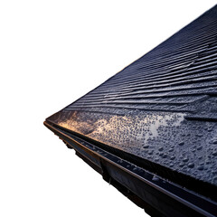 Angled, close-up view of a wet, textured roof