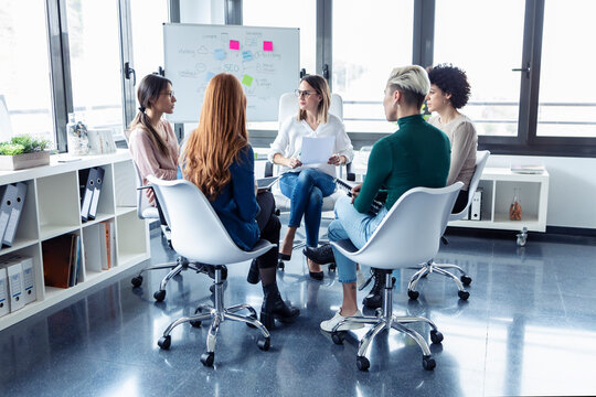 Businesswomen during meeting at a flipchart