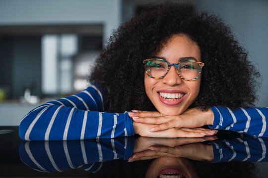Portrait of happy young woman wearing glasses