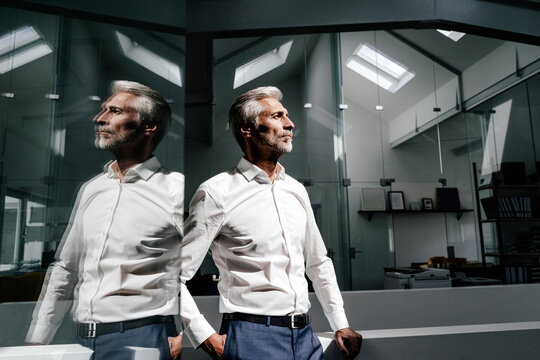 Mature businessman in office thinking