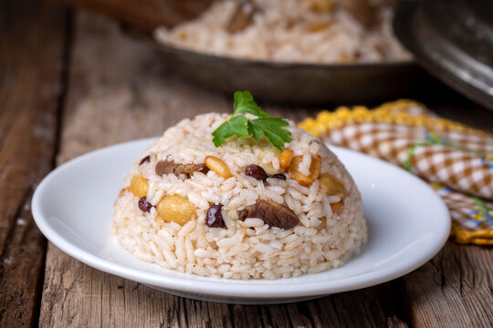 Traditional delicious Turkish food; rice pilaf with pine nuts and currants (Turkish name; bademli ic pilav or pilaf)