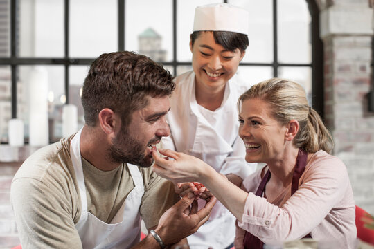 Couple tasting seeds in cooking class