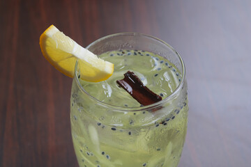 Refreshing iced cucumber lime beverage with basil seeds and cinnamon