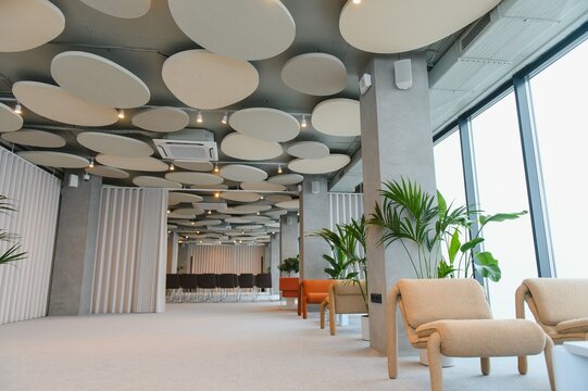 Modern office lounge interior with hanging acoustic panels