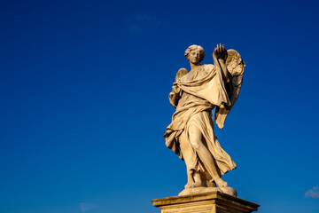 Obraz premium Angel Statue Against Blue Sky in Rome