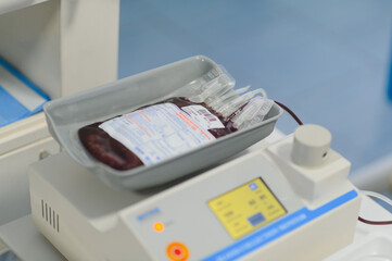 Blood bag resting on a medical weighing machine