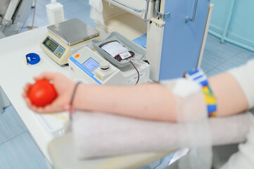 Fototapeta premium Blood donor with arm prepared for donation, collecting blood