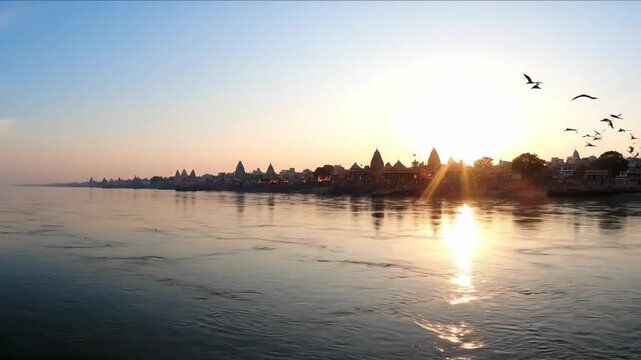 Serene Ganges River Scene at Sunset with Flying Birds and Historic Temples in Haridwar During Dussehra Festival