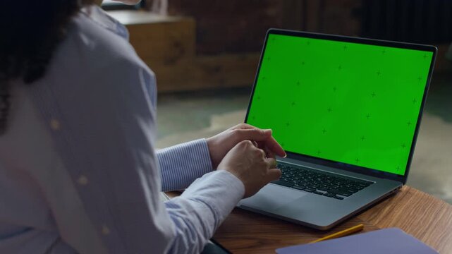 Laptop With Green Screen at Home Workspace