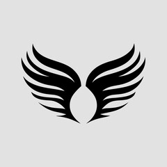 Obraz premium A black and white image of a pair of wings