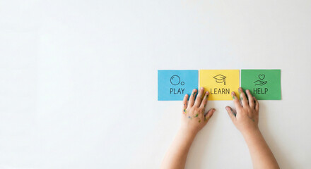 Child's hands with colorful cards Play Learn Help on white background, education and empathy concept