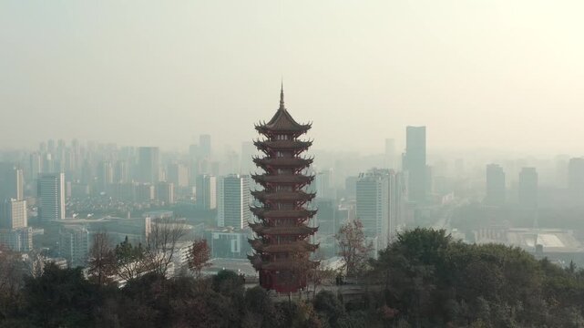 Chinese Pagoda Tower Overlooking Modern City Skyline