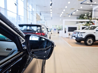 Car in modern car dealership showroom, professional automotive retail and buying concept.