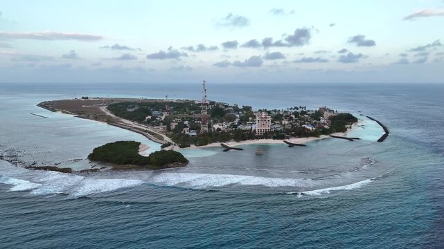 Drone Aerial Thulusdhoo Maldives remote tropical exotic island coral reef white sand turquoise water