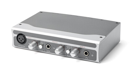 Obraz premium Professional external USB audio interface for home studio recording and music production, featuring XLR and guitar inputs with silver metal housing isolated on white background. 