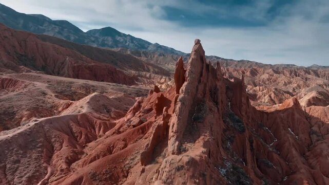 Aerial view of colorful rock formations in a desert landscape